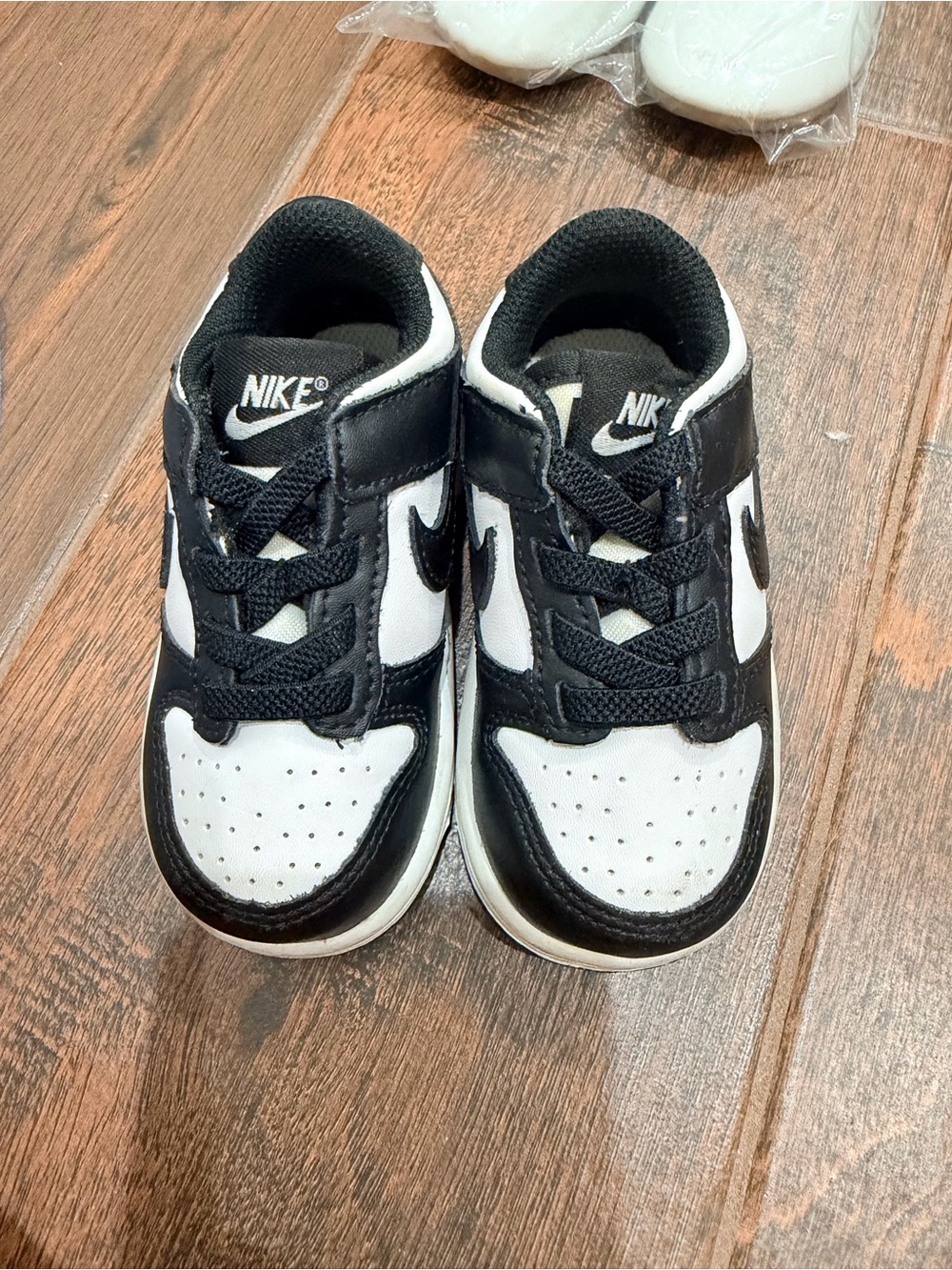 Nike Kids Black and White Low-Top Sneakers with Swoosh